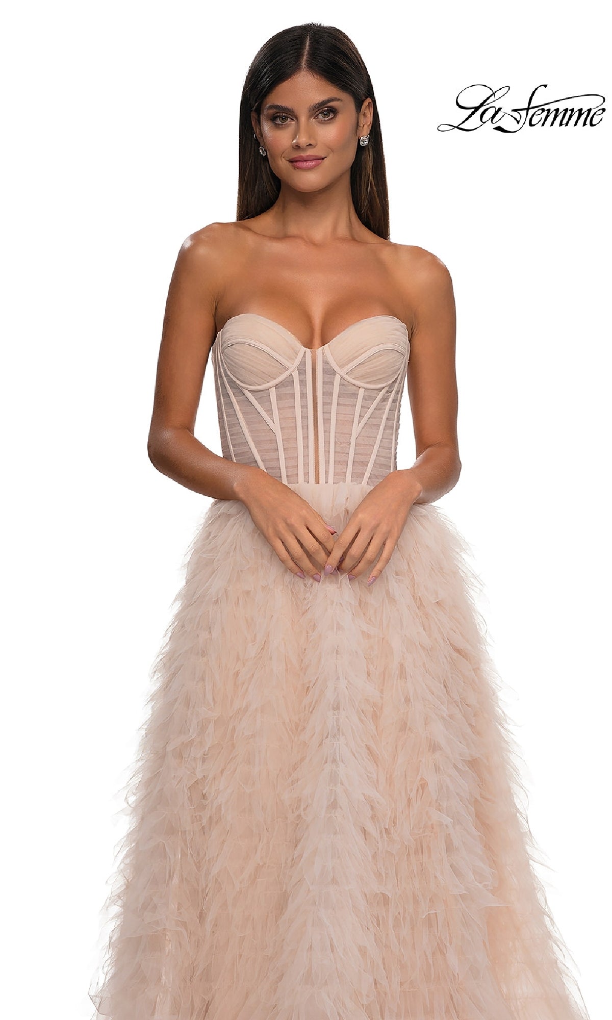 A woman wearing the Strapless Ruffled Prom Ball Gown: La Femme 32528 poses against a white background, with the